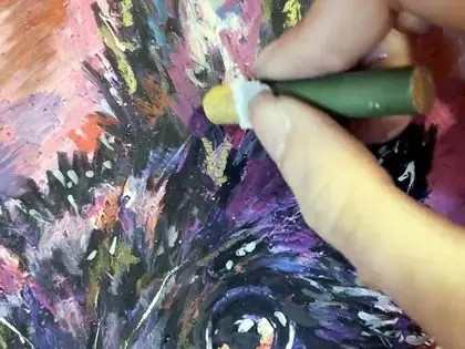 Oil pastel being worked into a dark coat.
